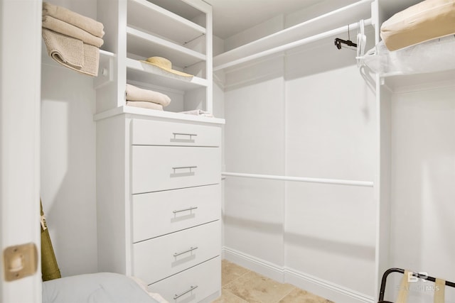 walk in closet featuring light tile patterned floors