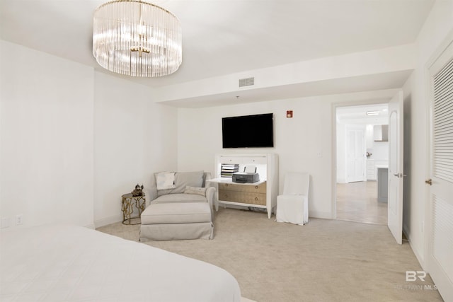 bedroom with a notable chandelier, baseboards, visible vents, and carpet floors