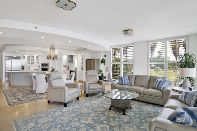 living area with recessed lighting and a chandelier