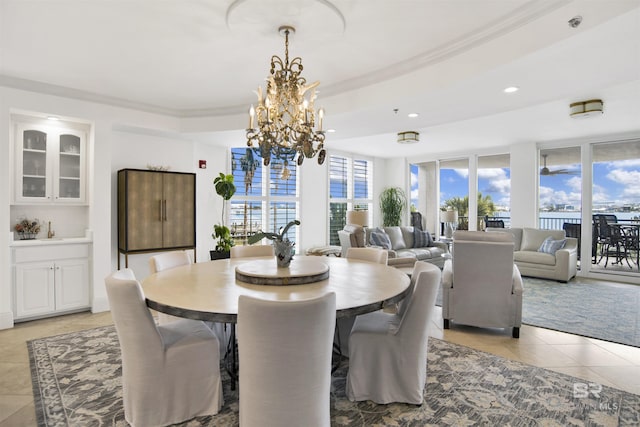 dining space featuring an inviting chandelier, light tile patterned floors, and recessed lighting