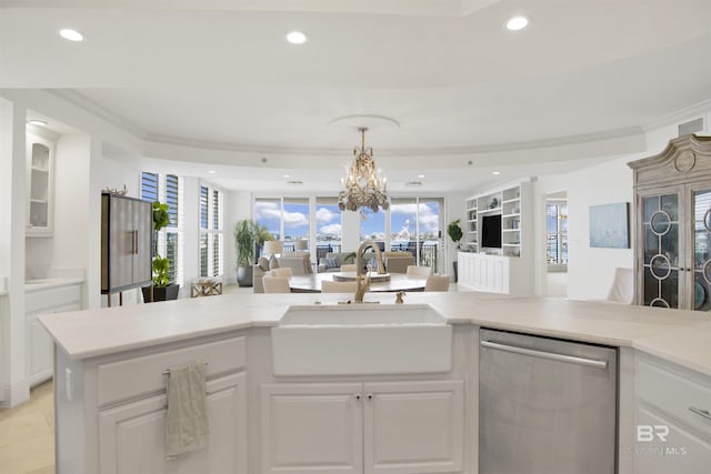 kitchen with recessed lighting, a sink, light countertops, dishwasher, and open floor plan