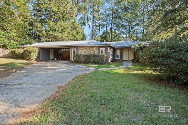 ranch-style house with a front lawn and a carport