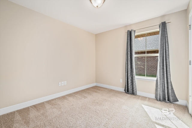 unfurnished room with light colored carpet