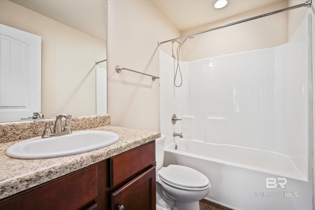 full bathroom featuring shower / bathing tub combination, vanity, and toilet