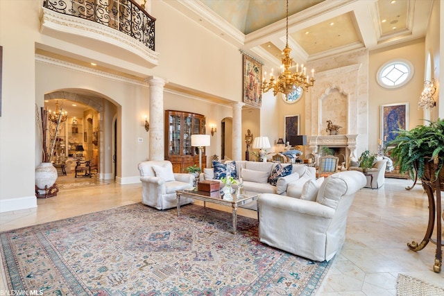 living room with ornate columns, light tile floors, a towering ceiling, and an inviting chandelier