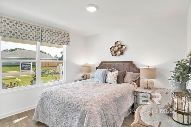 bedroom with hardwood / wood-style flooring