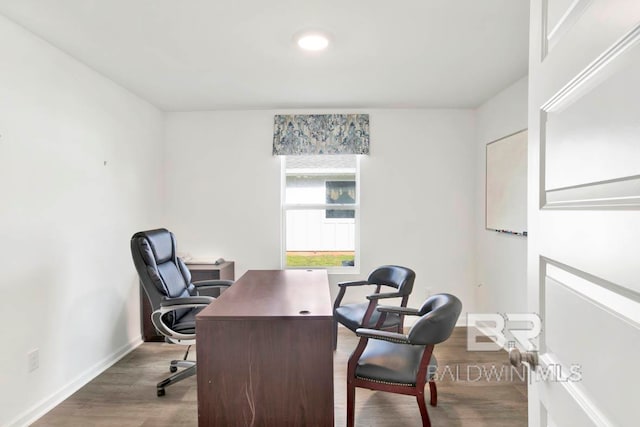 home office with dark wood-type flooring