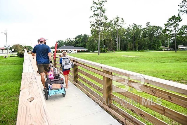 view of community featuring a lawn