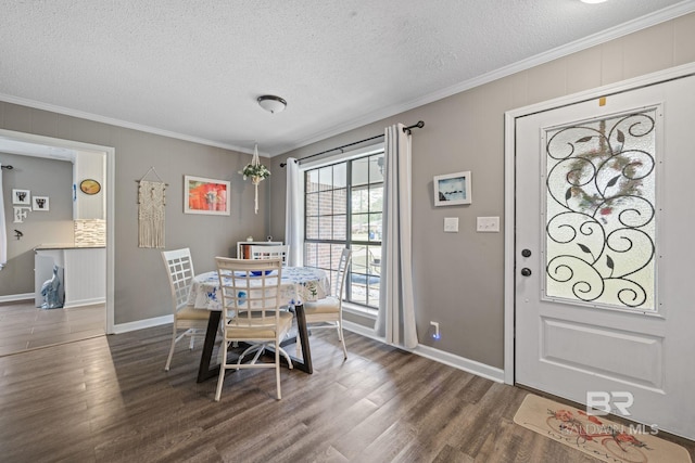 dining area with a textured ceiling, dark wood finished floors, and crown molding