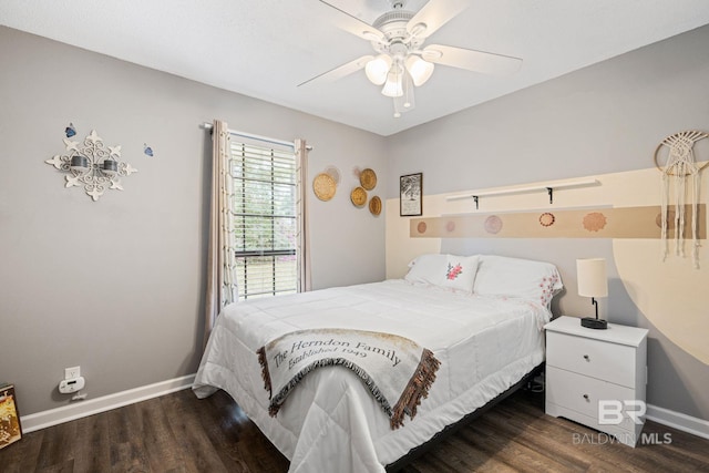 bedroom with a ceiling fan, baseboards, and wood finished floors