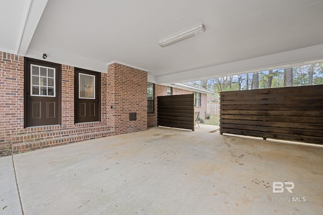 view of patio featuring fence