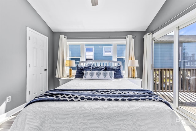 bedroom with lofted ceiling, access to exterior, ceiling fan, and baseboards