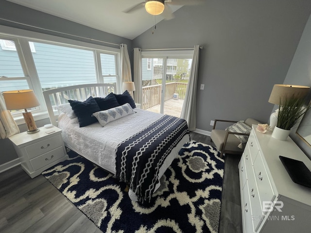 bedroom with baseboards, dark wood-style floors, ceiling fan, access to exterior, and vaulted ceiling