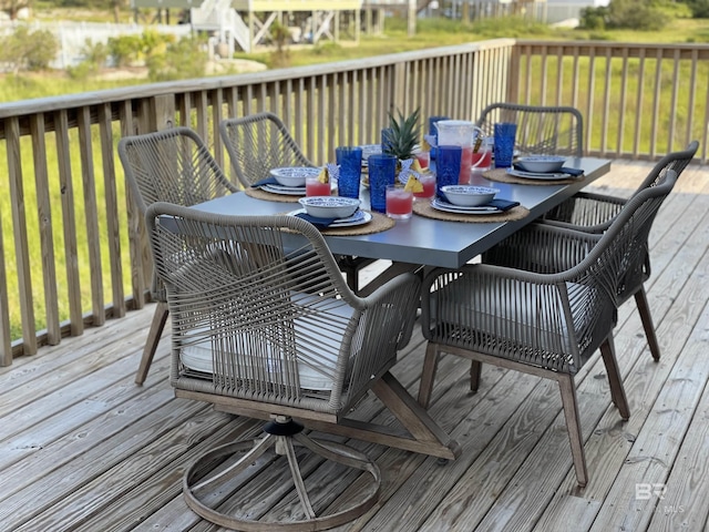 wooden terrace with outdoor dining space