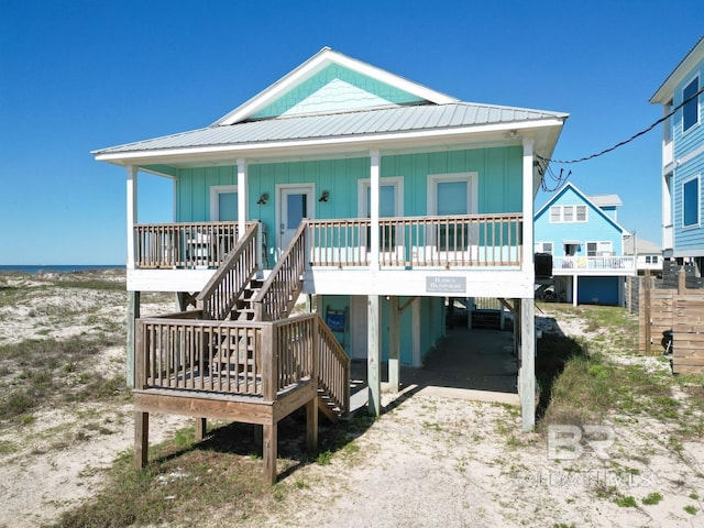 view of front of property featuring a carport and covered porch