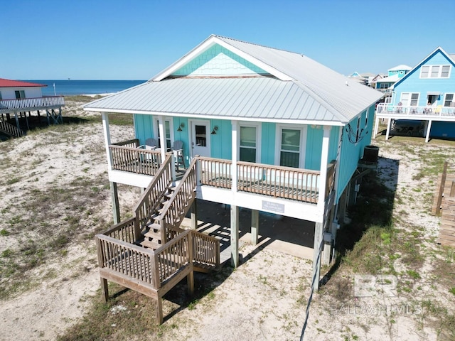 view of front of property with a porch and a water view