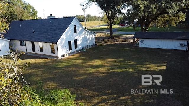 view of side of home featuring a yard