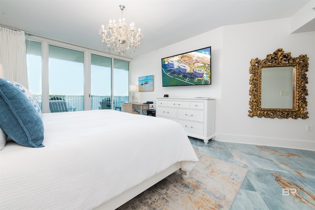 bedroom with a chandelier, a wall of windows, and access to exterior