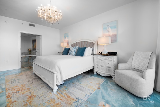 bedroom with connected bathroom and a notable chandelier