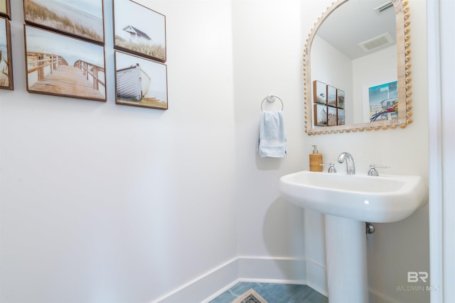 bathroom with tile patterned flooring