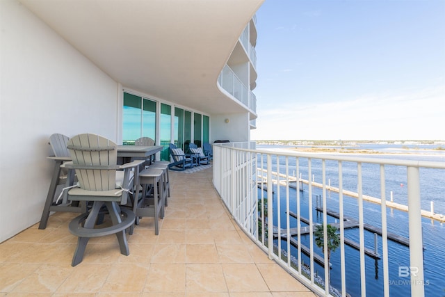 balcony featuring a water view