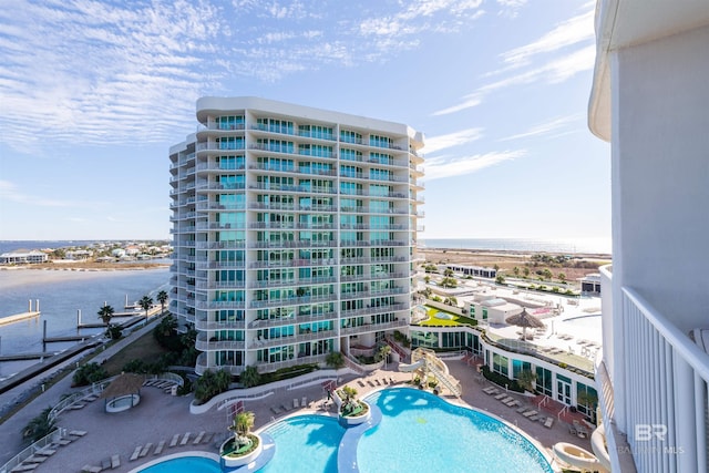 view of pool with a water view