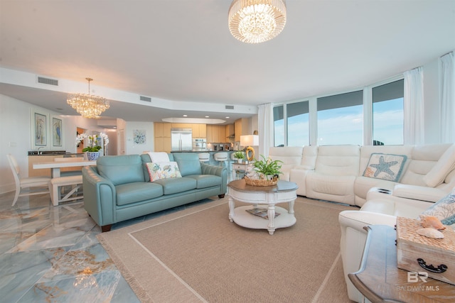 living room featuring a chandelier and floor to ceiling windows