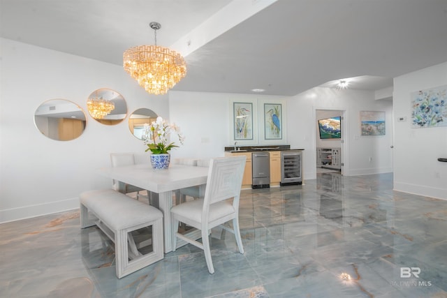 dining room featuring an inviting chandelier, wine cooler, and sink