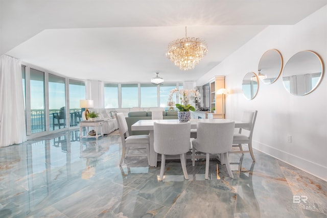 dining space with an inviting chandelier and expansive windows