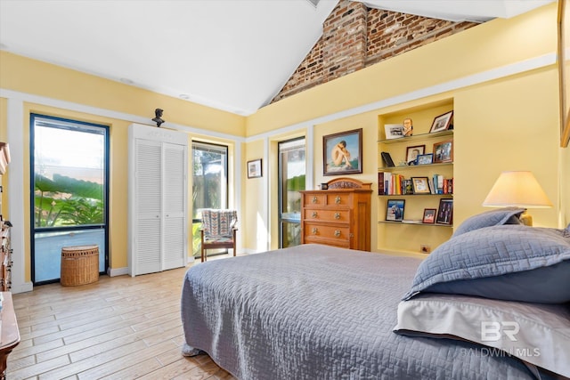 51 N Jackson St Unit A, Mobile, AL 36602 - bedroom with multiple windows, access to outside, light wood-style floors, and high vaulted ceiling