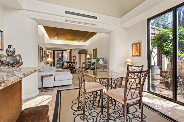 51 N Jackson St Unit A, Mobile, AL 36602 - dining space with plenty of natural light, light tile patterned flooring, and a raised ceiling