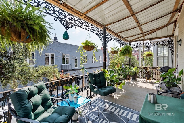 view of patio / terrace with an outdoor living space and a wooden deck