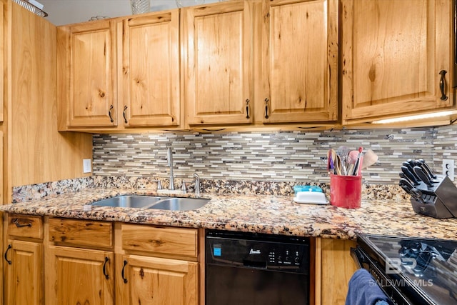 kitchen with decorative backsplash, black appliances, light stone countertops, and sink