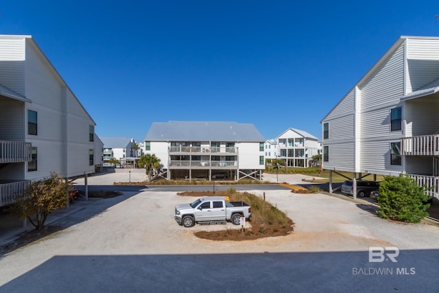 partially covered parking lot with a residential view