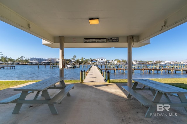 dock area with a water view