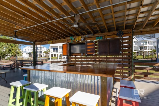 exterior space with outdoor dry bar and ceiling fan