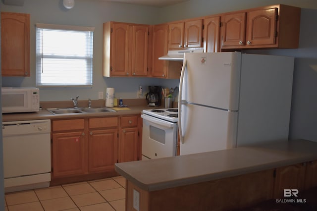 kitchen featuring white appliances, light tile patterned floors, and sink