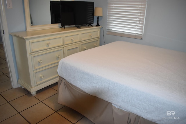 bedroom featuring light tile patterned flooring