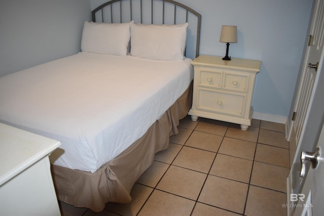 bedroom with light tile patterned flooring