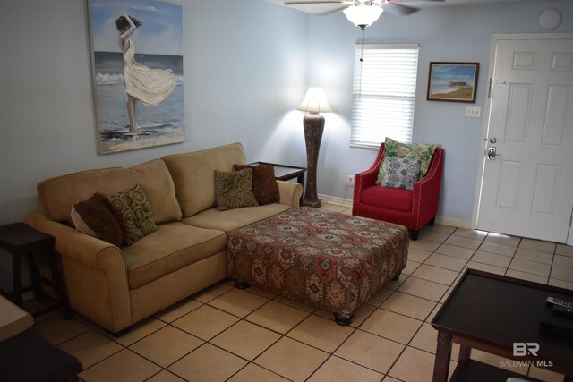 living room featuring ceiling fan and light tile patterned floors