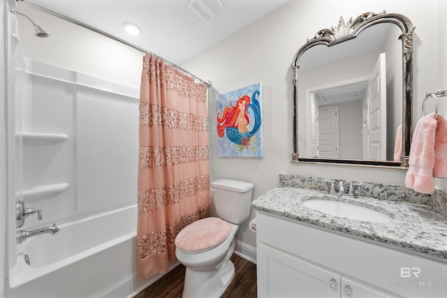 bathroom with toilet, visible vents, shower / tub combo, wood finished floors, and vanity