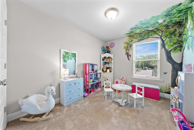 rec room featuring baseboards and carpet
