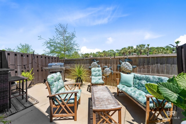 view of patio / terrace with a wooden deck, fence, a grill, and an outdoor hangout area