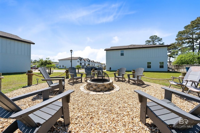 exterior space featuring an outdoor fire pit