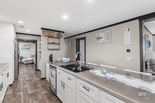 11691 Grantham Rd, Foley, AL 36535 - kitchen with crown molding, white cabinetry, appliances with stainless steel finishes, dark wood finished floors, and light countertops