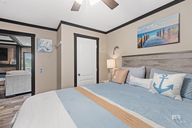 11691 Grantham Rd, Foley, AL 36535 - bedroom with crown molding, wood finished floors, a ceiling fan, and access to exterior