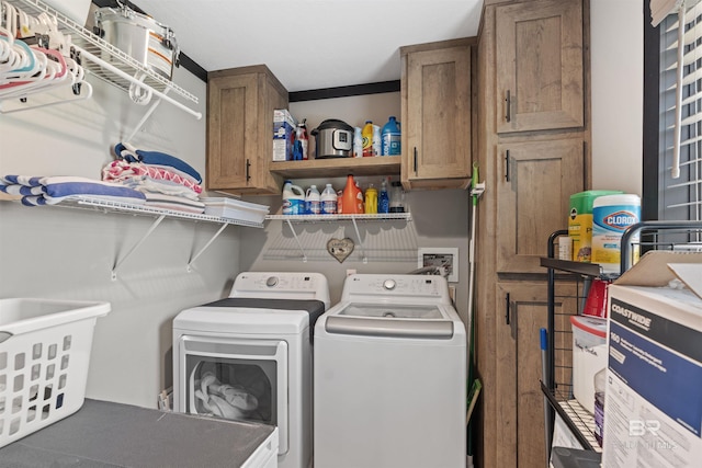11691 Grantham Rd, Foley, AL 36535 - laundry room featuring separate washer and dryer and cabinet space