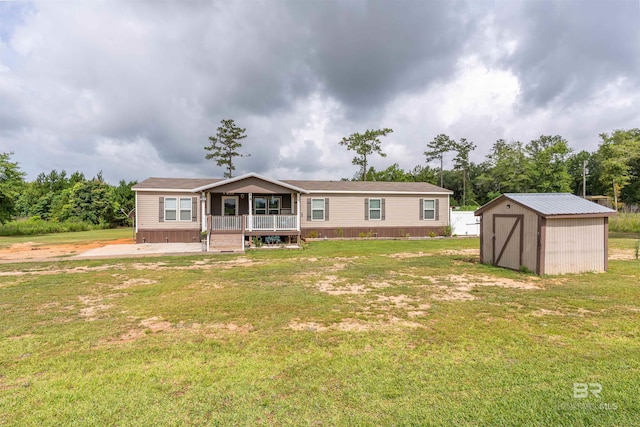 11691 Grantham Rd, Foley, AL 36535 - view of front facade with a shed, a front lawn, and covered porch