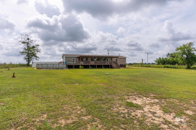 11691 Grantham Rd, Foley, AL 36535 - back of property featuring a deck, stairs, and a lawn