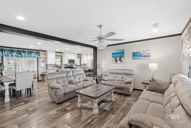 11691 Grantham Rd, Foley, AL 36535 - living room featuring wood finished floors, a ceiling fan, recessed lighting, and ornamental molding